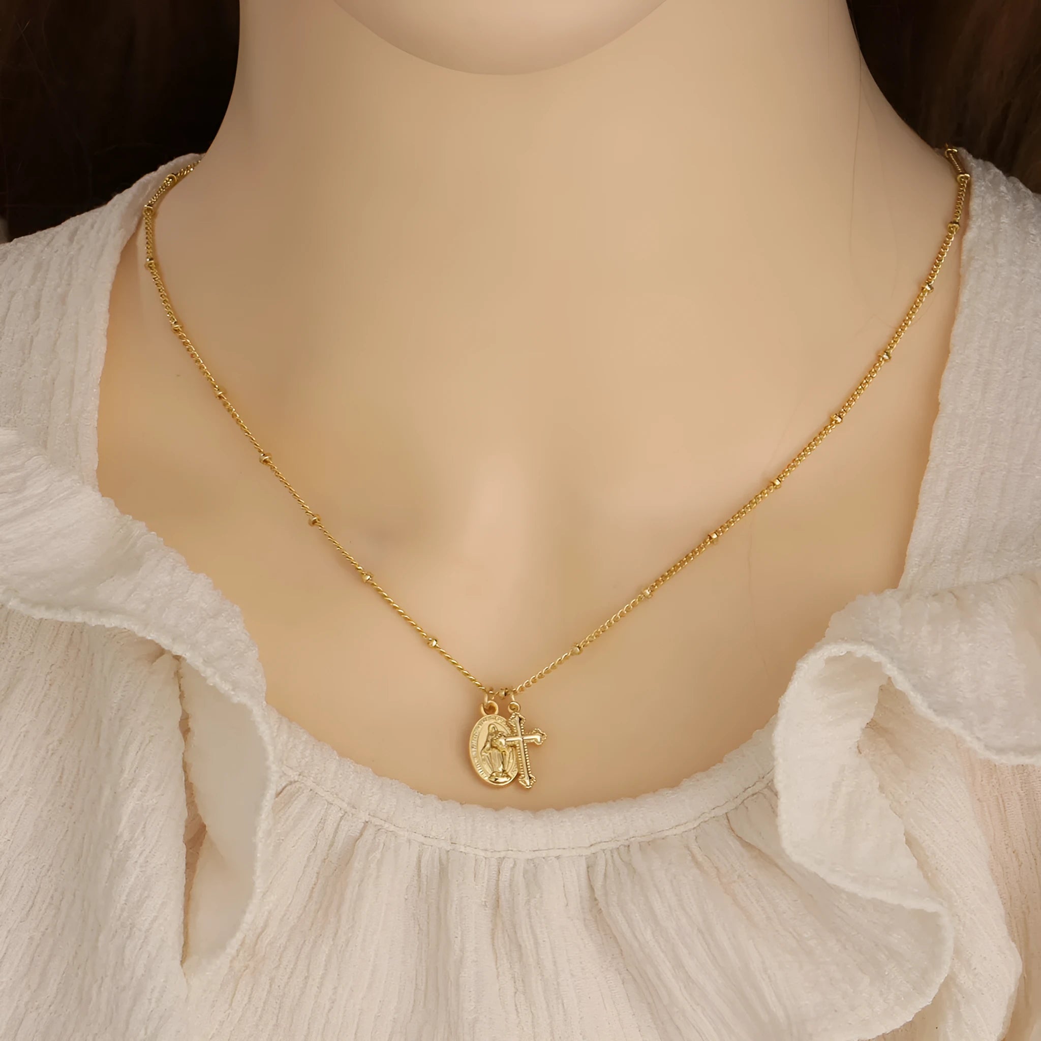 Golden Virgin Mary necklace with geometric cross pendant on copper chain
