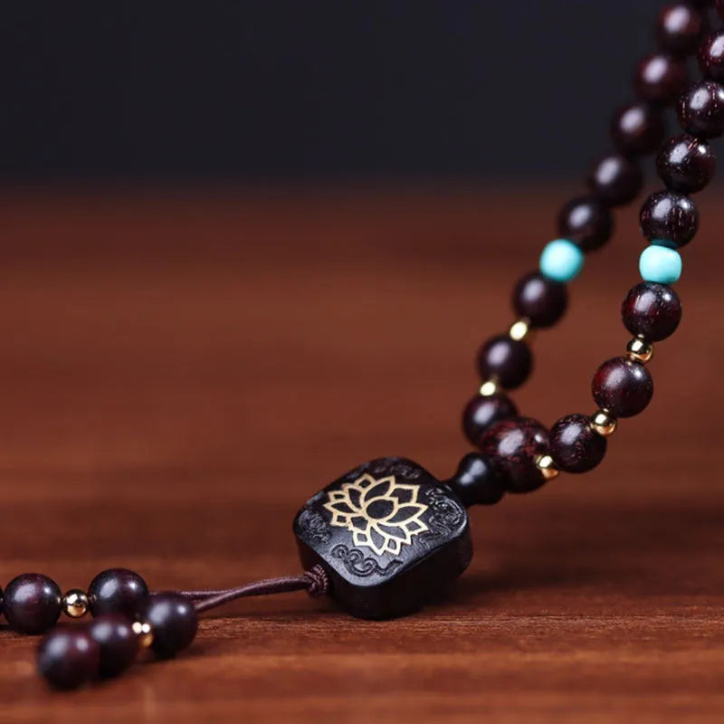 Zambia rosewood Buddha beads bracelet with flat lotus pendant showing 108 beads