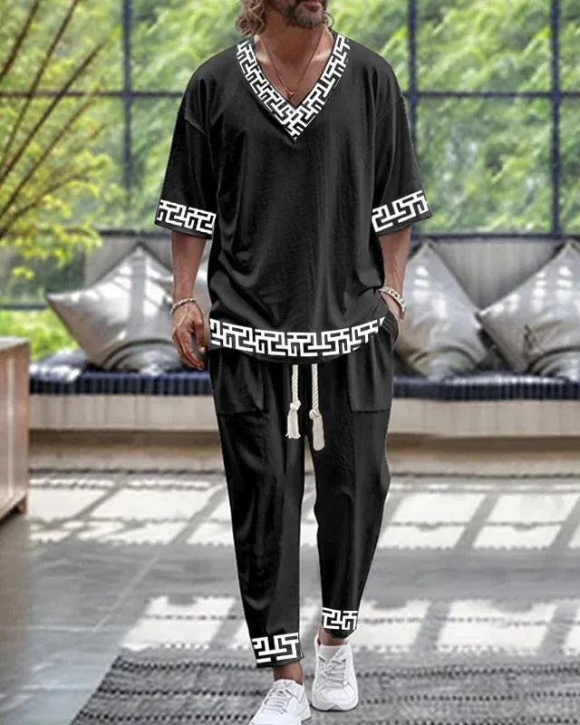 Man wearing a thin polyester V-neck trousers suit with cropped sleeves, available in multiple colours and sizes up to 6XL.