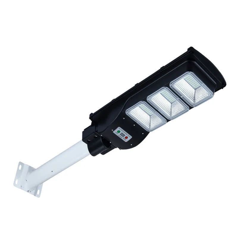 Integrated solar street light with aluminium housing and solar panel, showing remote control and outdoor installation