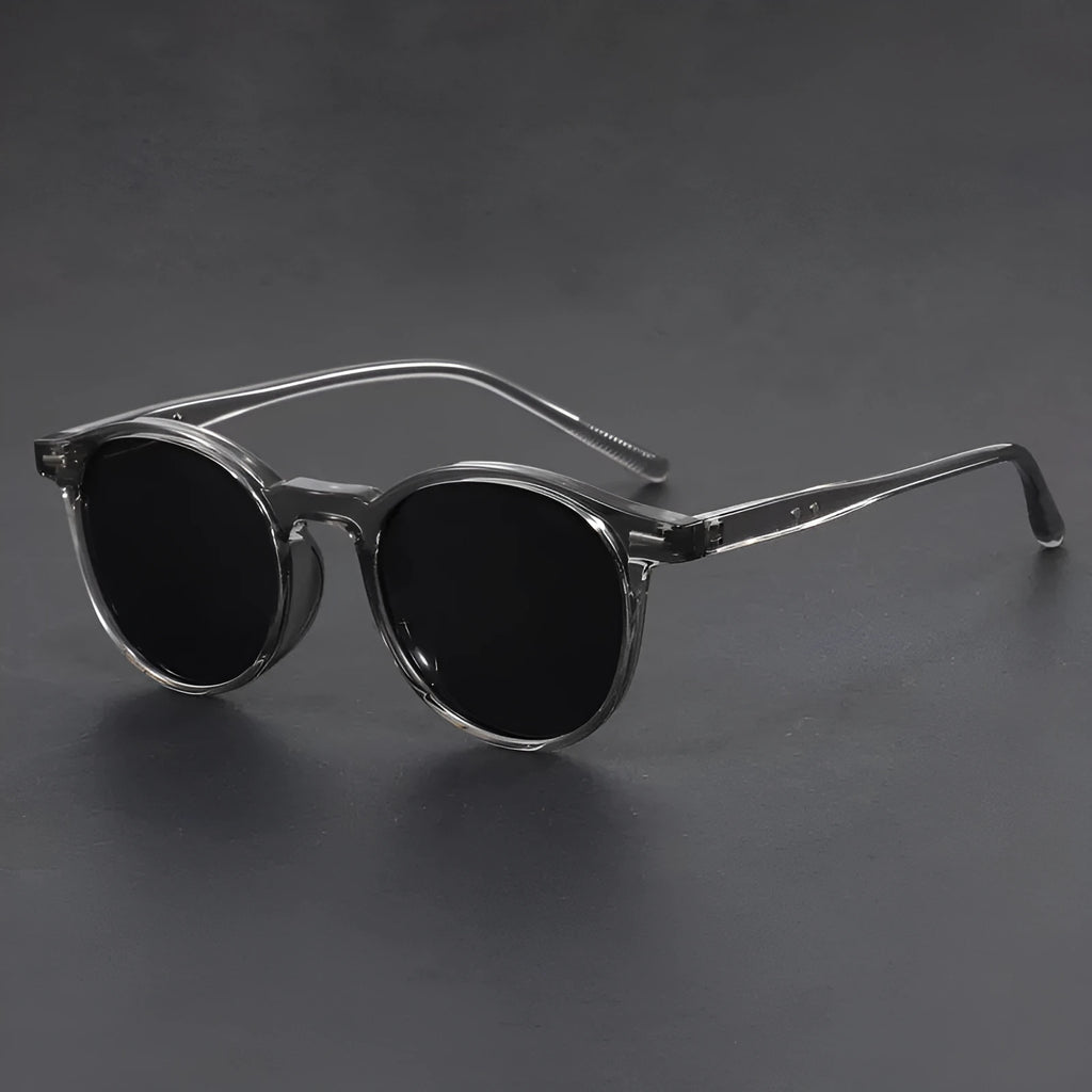 Retro round oval frame sunglasses with polarised grey lenses shown in multiple colour options.