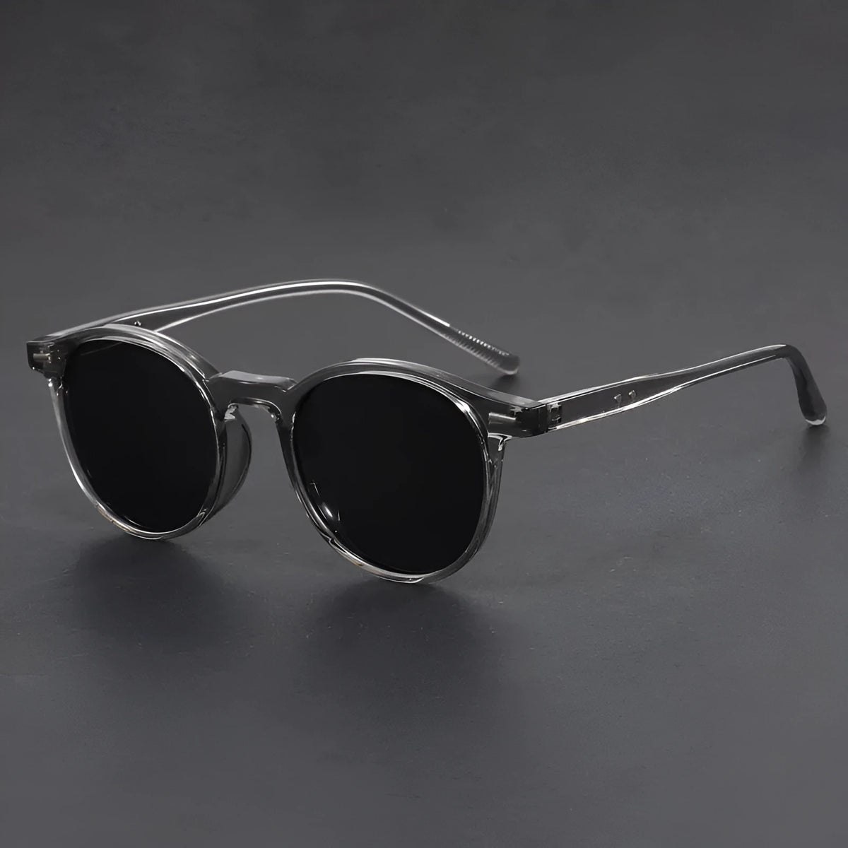 Retro round oval frame sunglasses with polarised grey lenses shown in multiple colour options.