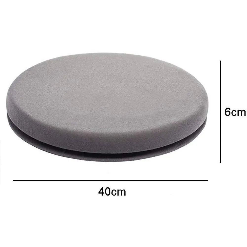 Round, grey rotating car seat cushion for elderly passenger assistance on a car seat.