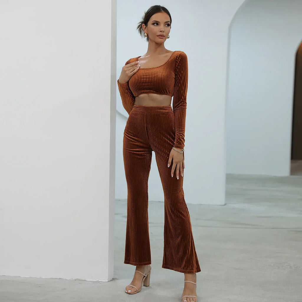 Caramel-colour long sleeve sweater and matching trousers casual set on a hanger.