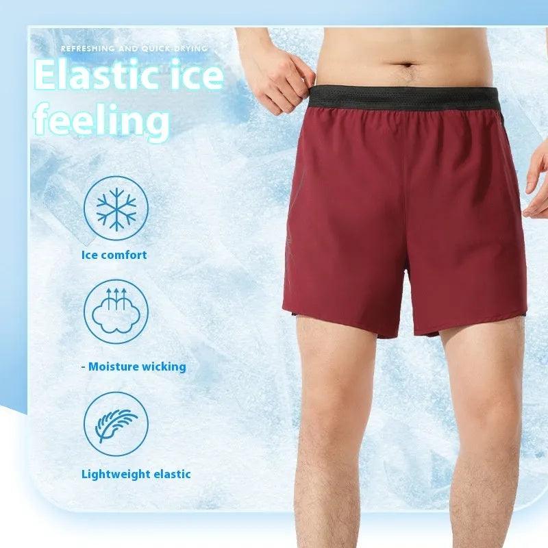 Men's solid colour basketball shorts in polyester fabric with low waist cut