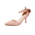 Women's black stiletto high heels with pointed toe, ankle buckle, and a bowknot detail on the suede upper.