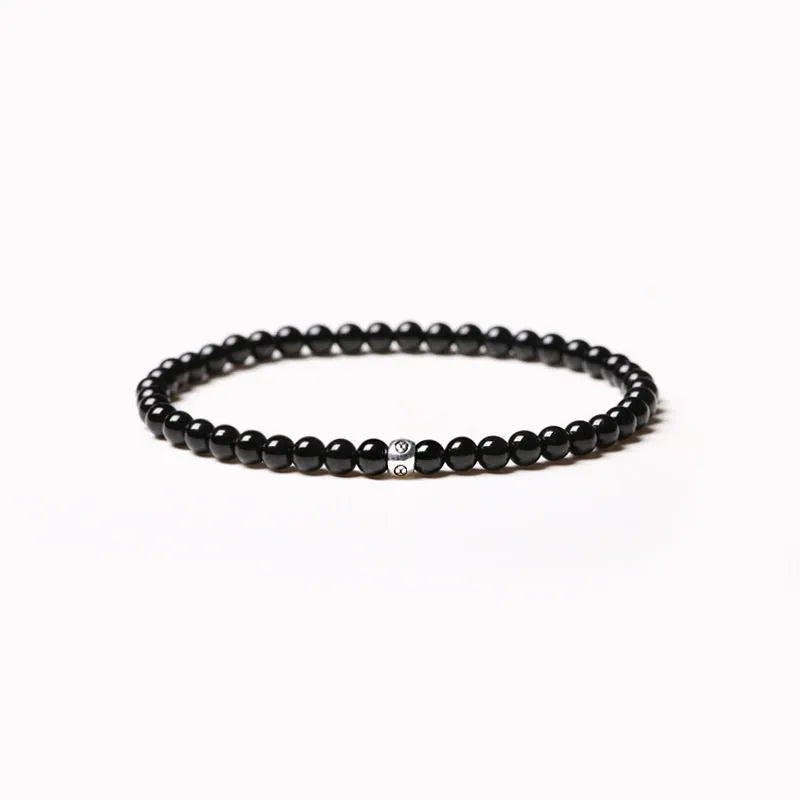 Geometric cut surface black agate bracelet with 4mm obsidian, blue san, and black agate beads