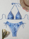 Women's denim blue printed strap bikini set on white background