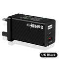 White GaN 65W universal laptop charger with USB PD port showing compact dimensions
