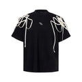 Black short-sleeved T-shirt with padded shoulders and rivet ribbon detail in loose fit style