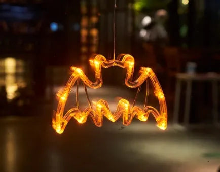 Halloween battery-powered LED window lights with suction cups showing spider, pumpkin and ghost designs