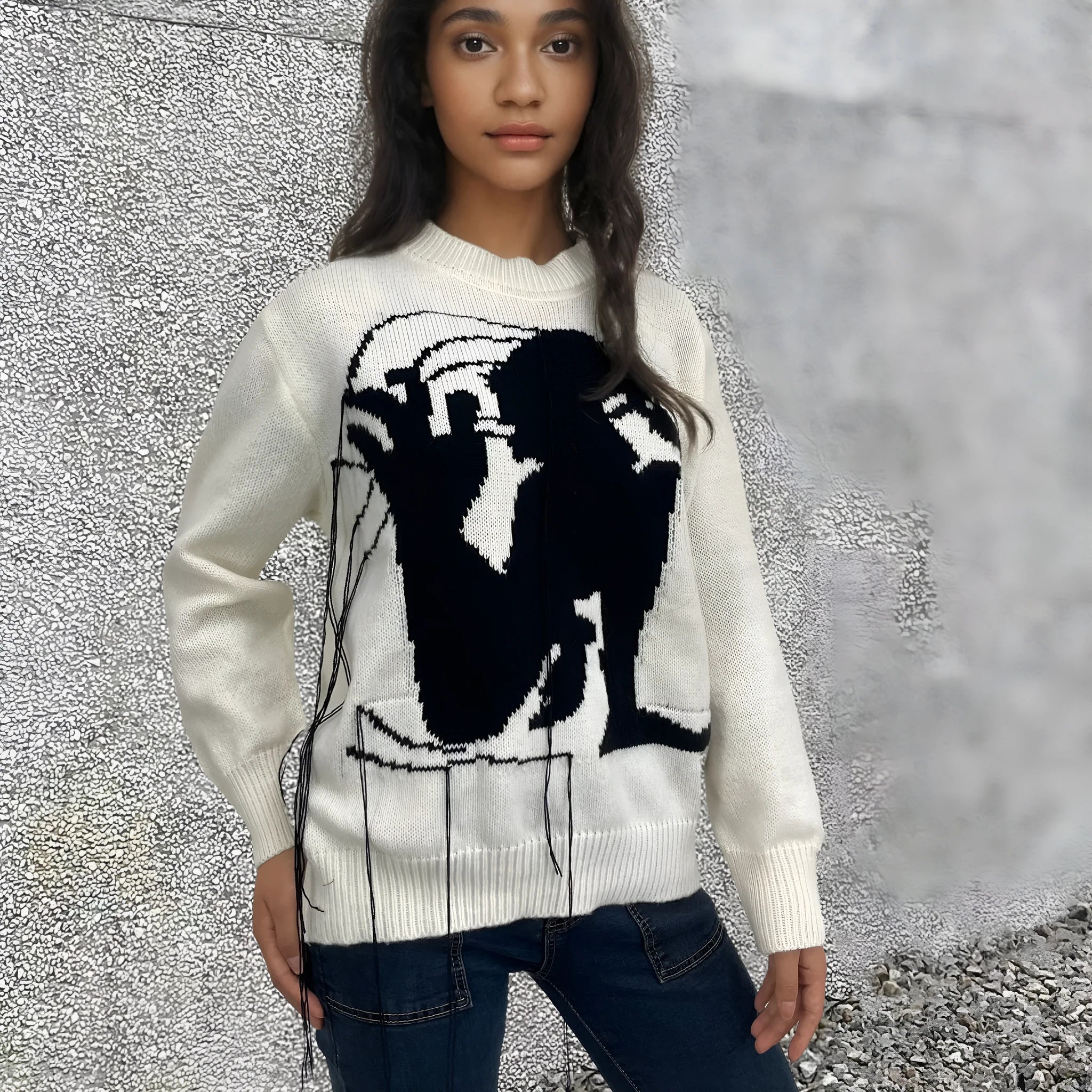 Women's grey alpaca wool sweater with tassel detailing and abstract pattern