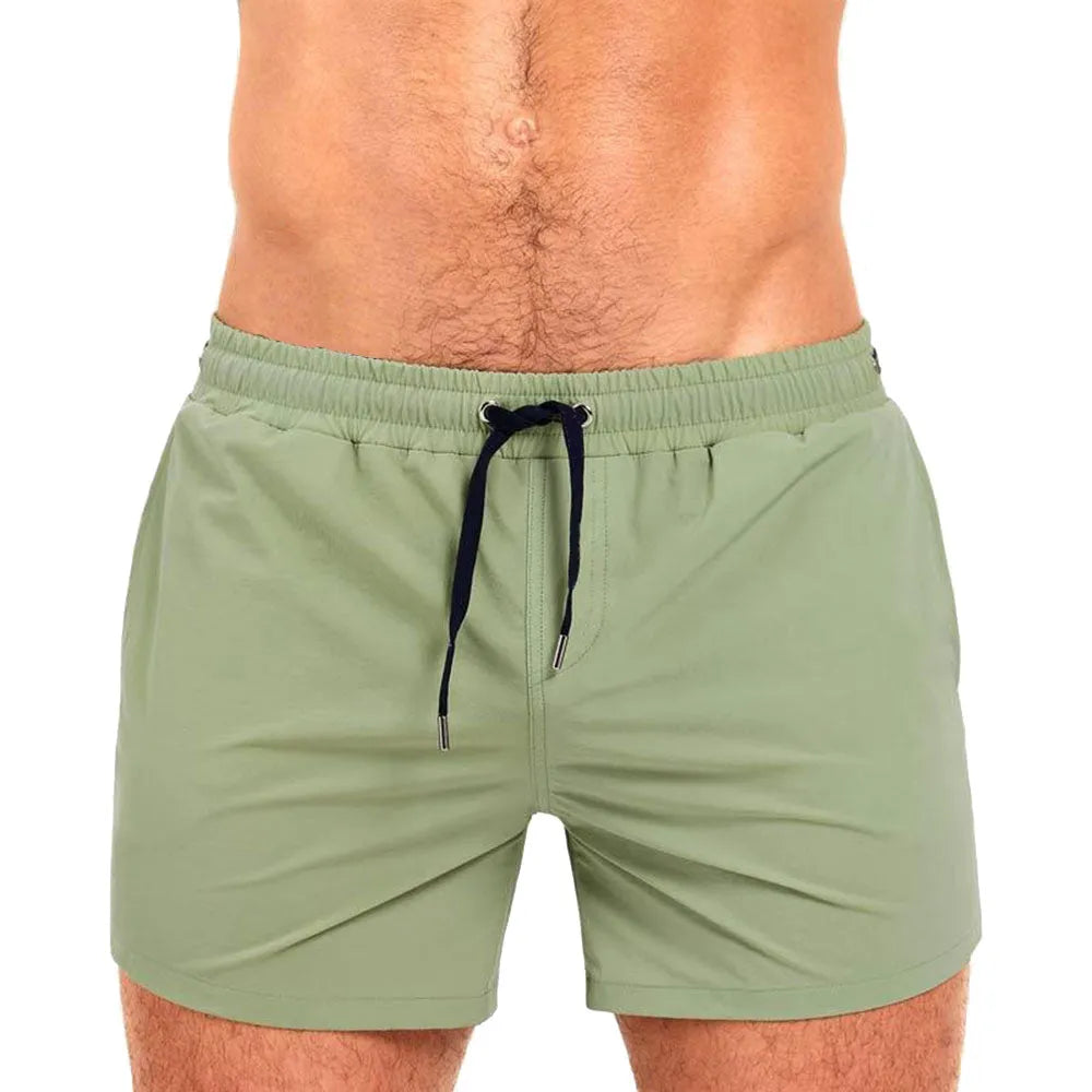 Men's solid colour swimming shorts with mesh lining for sports and fitness in Army Green.