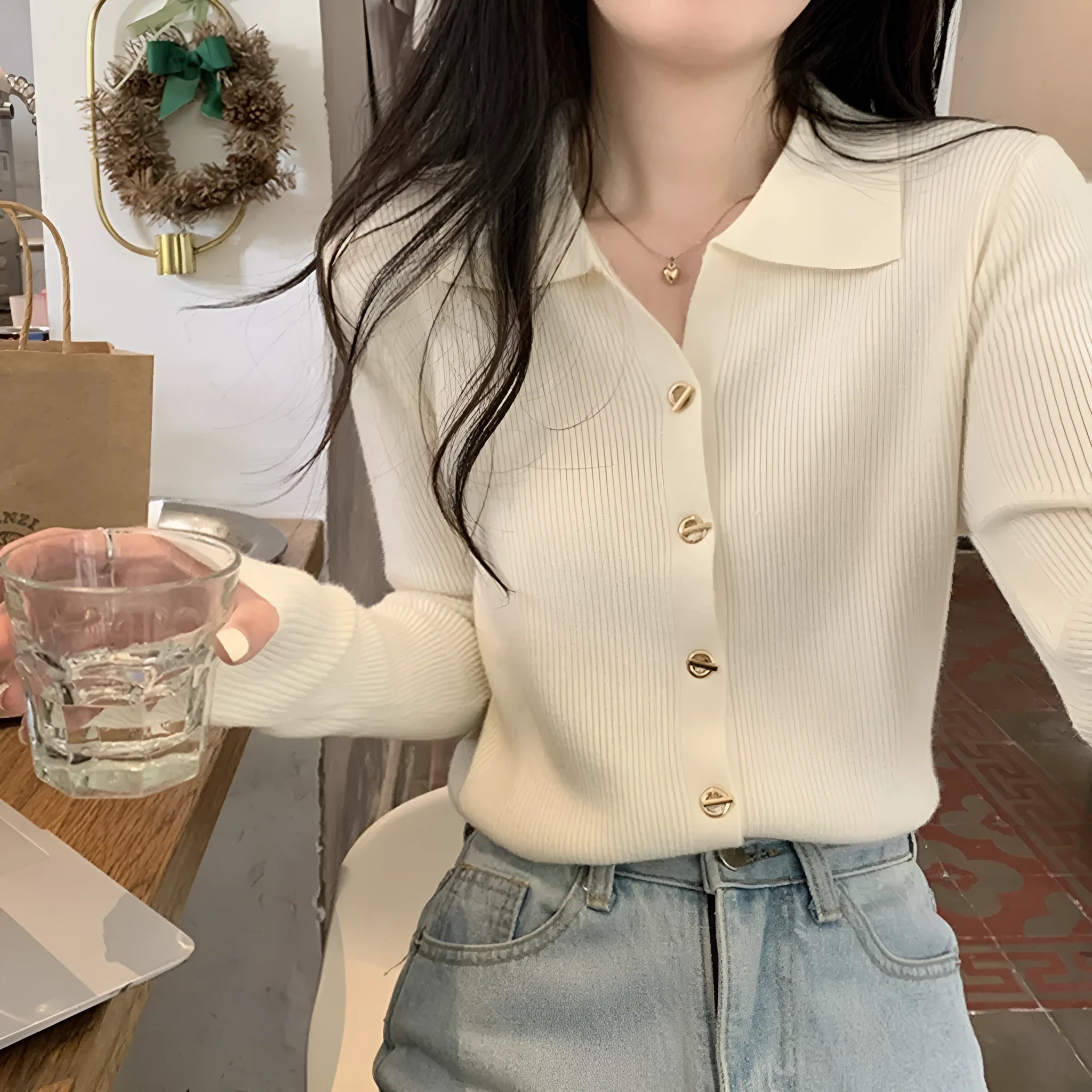 Women's beige loose-fit viscose knitted cardigan top with long sleeves shown worn open.