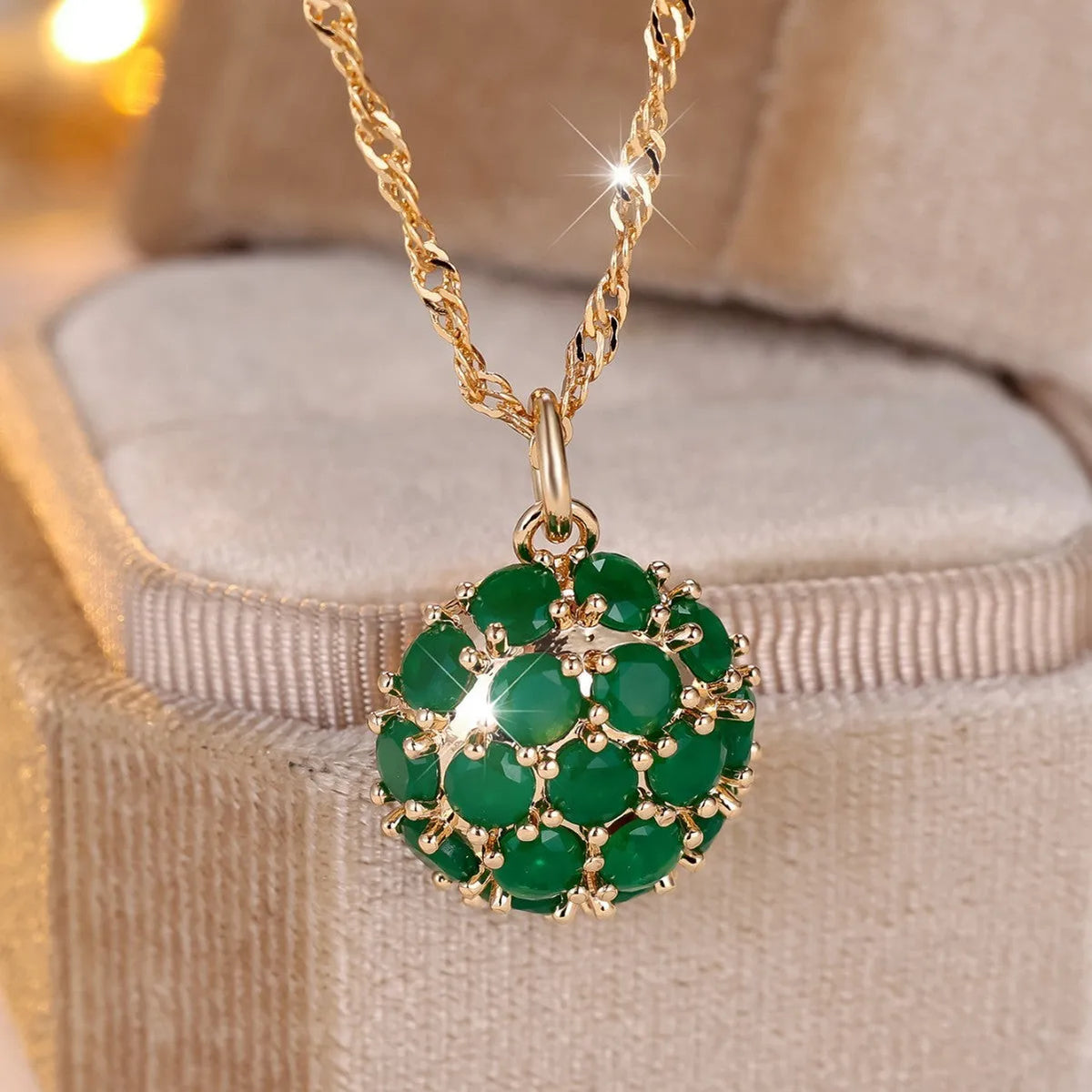 Round geometric emerald diamond necklace with champagne gold finish and adjustable chain