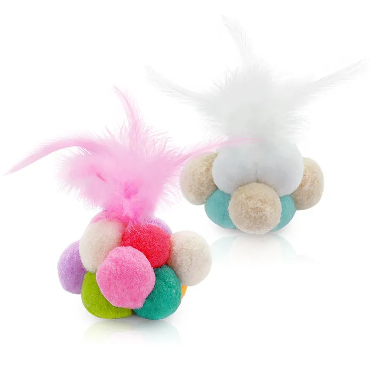 Cat toy feather wand with colourful pink and blue white feathers and a bouncy ball.