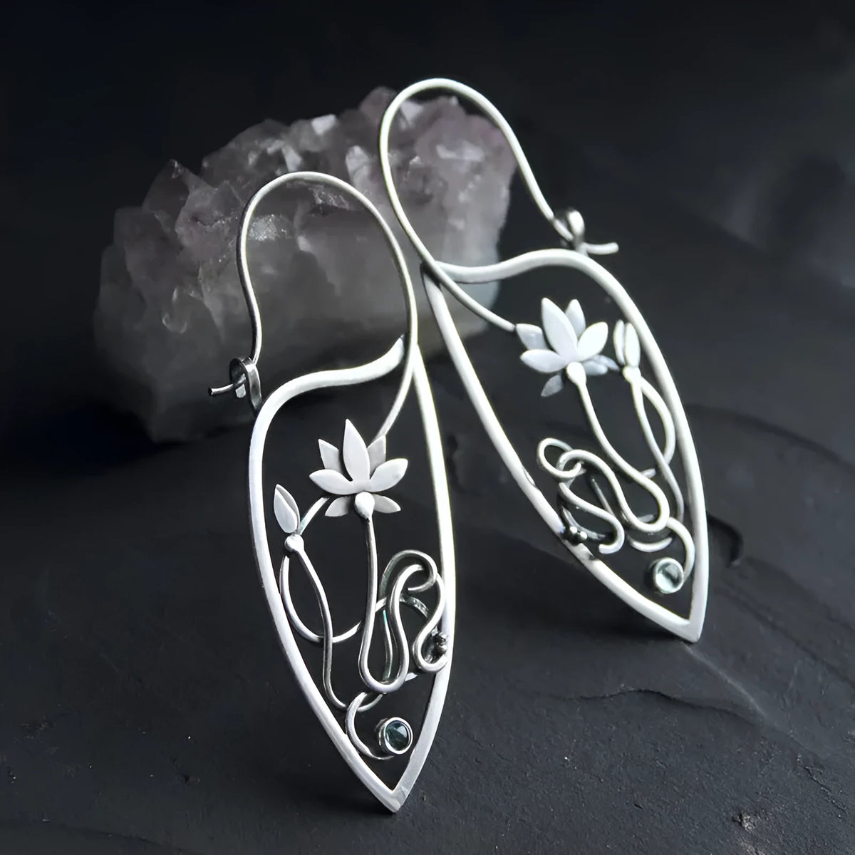 Silver lotus vine rhinestone earrings with geometric floral design