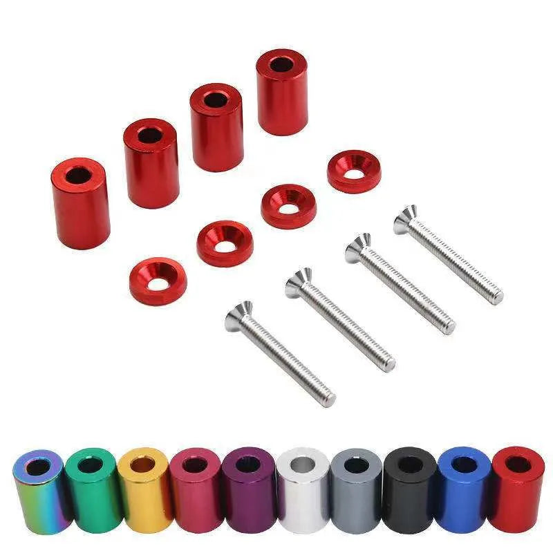 Aluminium engine cover spacers in black, blue, and red colours with installation hardware