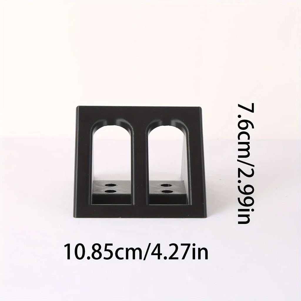 Black plastic pistol stand with punk-style detailing measuring 10.85 cm