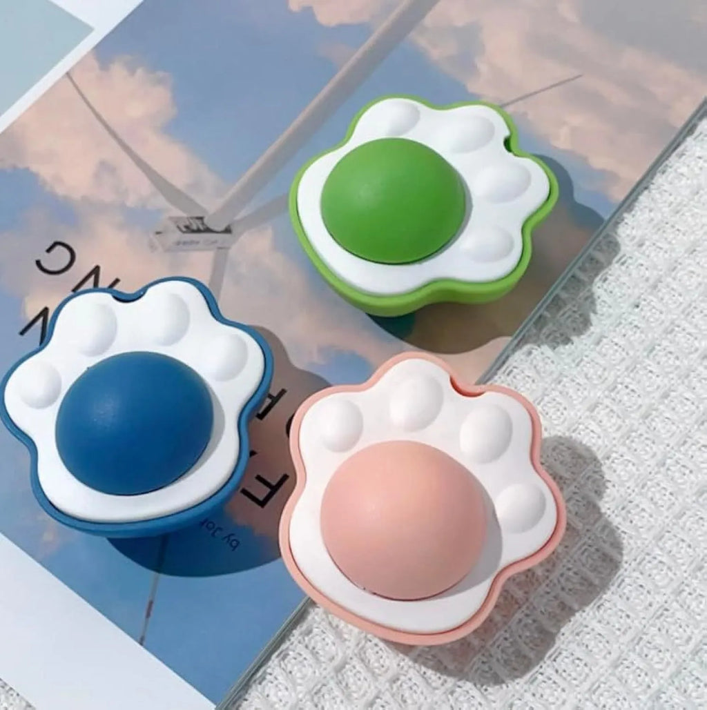 Catnip dental chew balls with edible vine components in blue, green and pink colours
