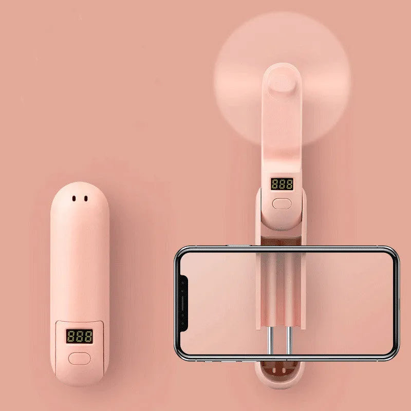 Folding mini USB desk fan in green showing compact folded and unfolded positions