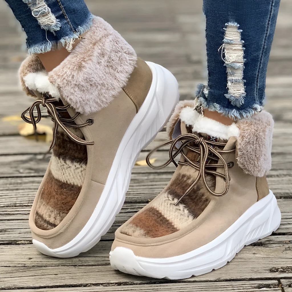 Beige women's lace-up suede snow boots with plush lining and a thick rubber sole.