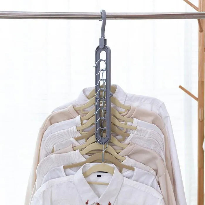 Plastic clothes hanger with rotating hook shown in pink, dimensions 33 cm long by 17 cm high