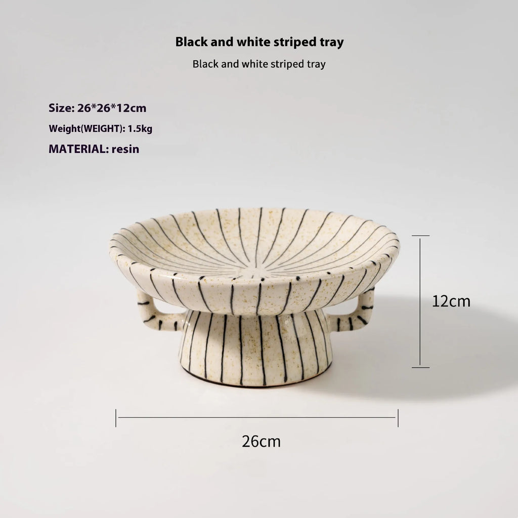 Black and white striped retro synthetic resin fruit plate ornament.