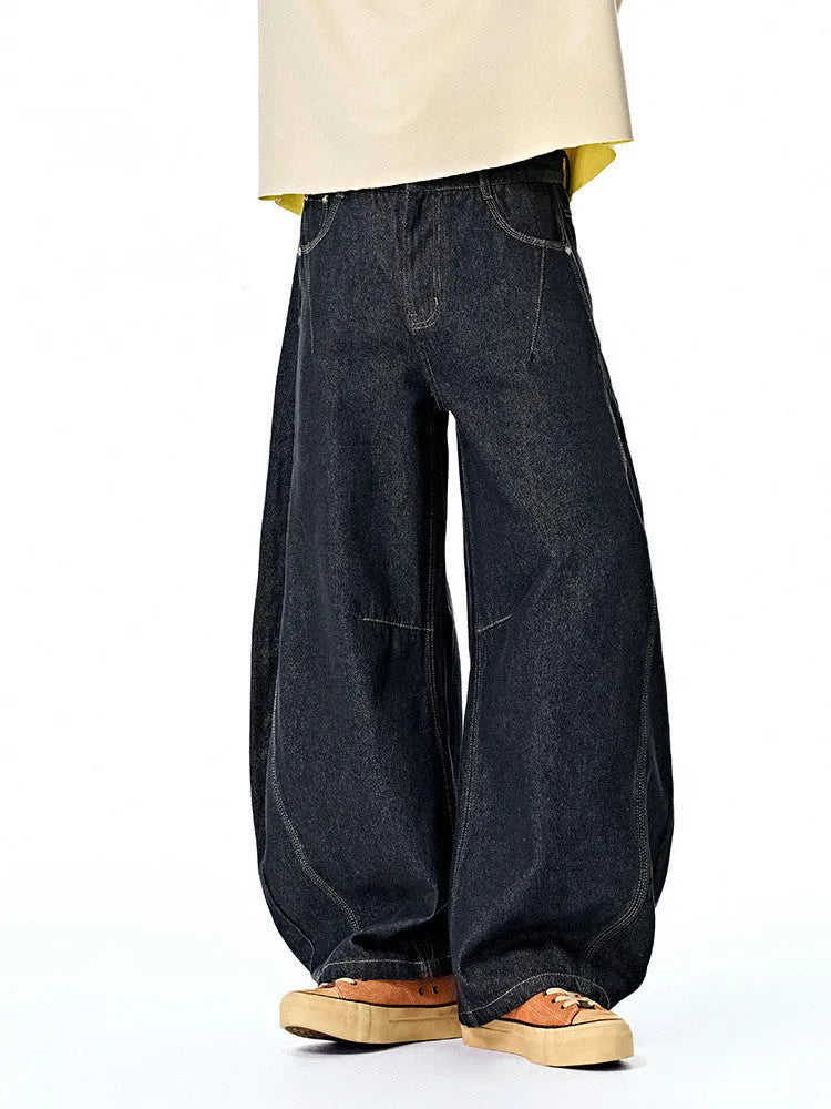 Men's wide-leg denim trousers in original cow colour, showing relaxed fit and mid-waist design.