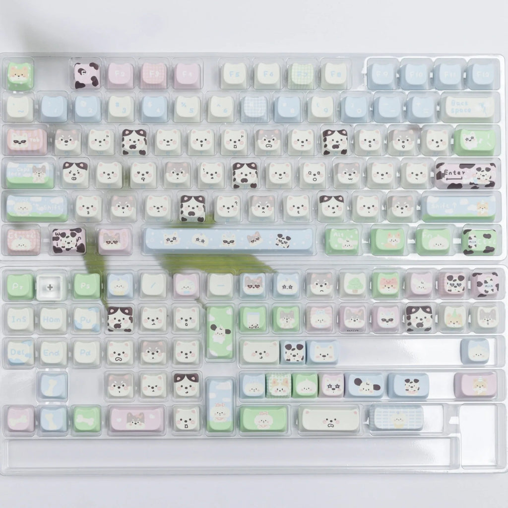 PBT sublimation keycap set showing detailed puppy and cat designs on mechanical keyboard keys