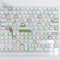 PBT sublimation keycap set showing detailed puppy and cat designs on mechanical keyboard keys