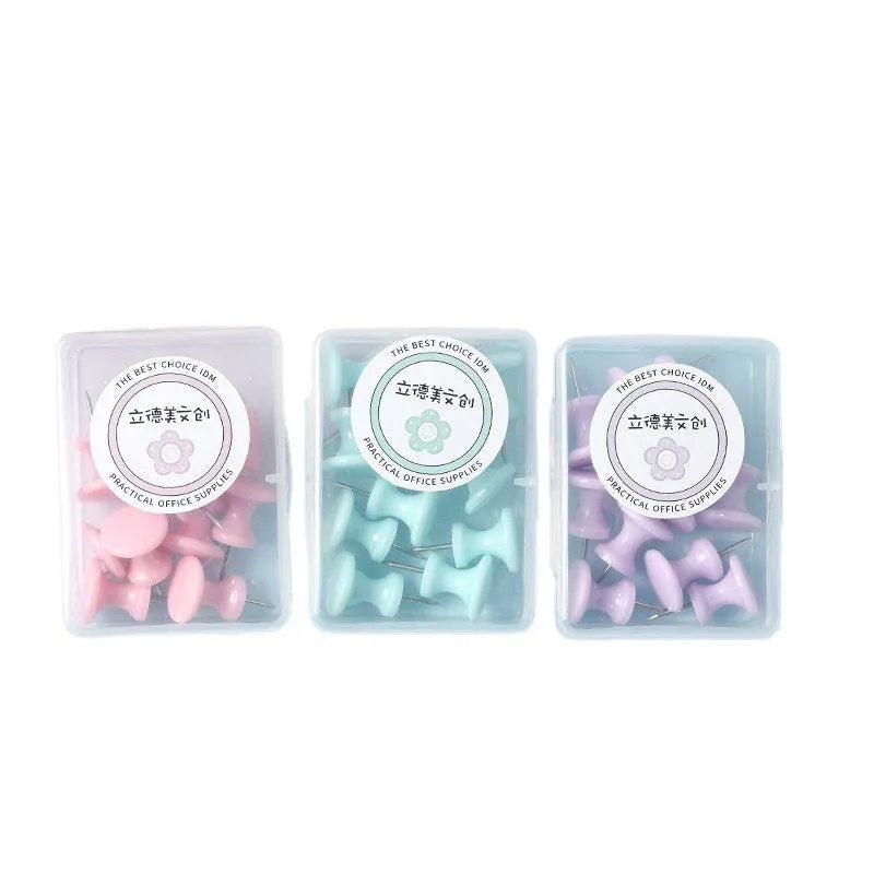 Box of colourful plastic push pins in cherry blossom pink, mint green and lavender macaron colours