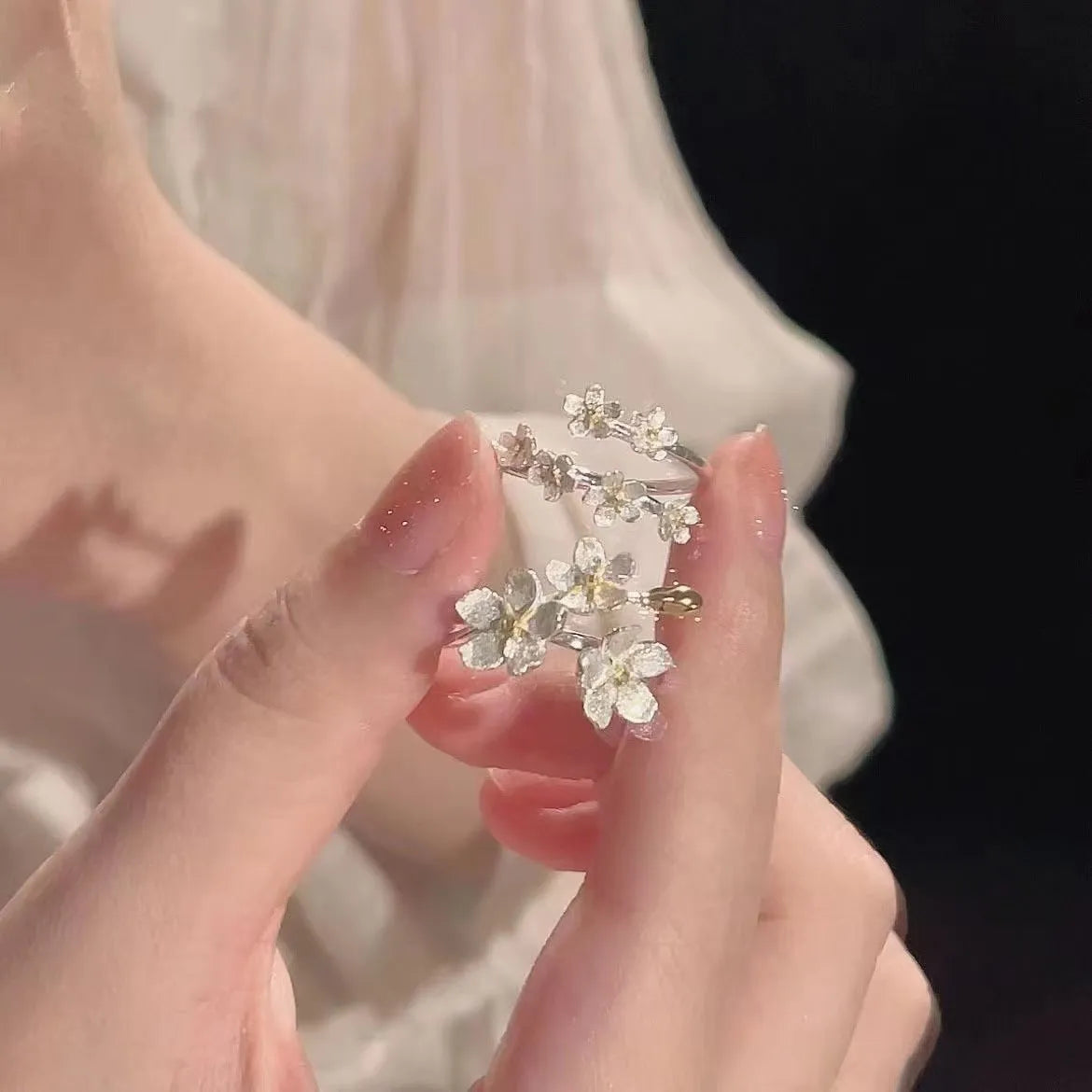 Adjustable open mouth ring with three-dimensional jasmine flower design and electroplated finish