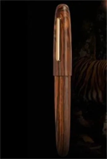 Wooden ballpoint pen with rotating cap showing alpine pear finish and straight tip