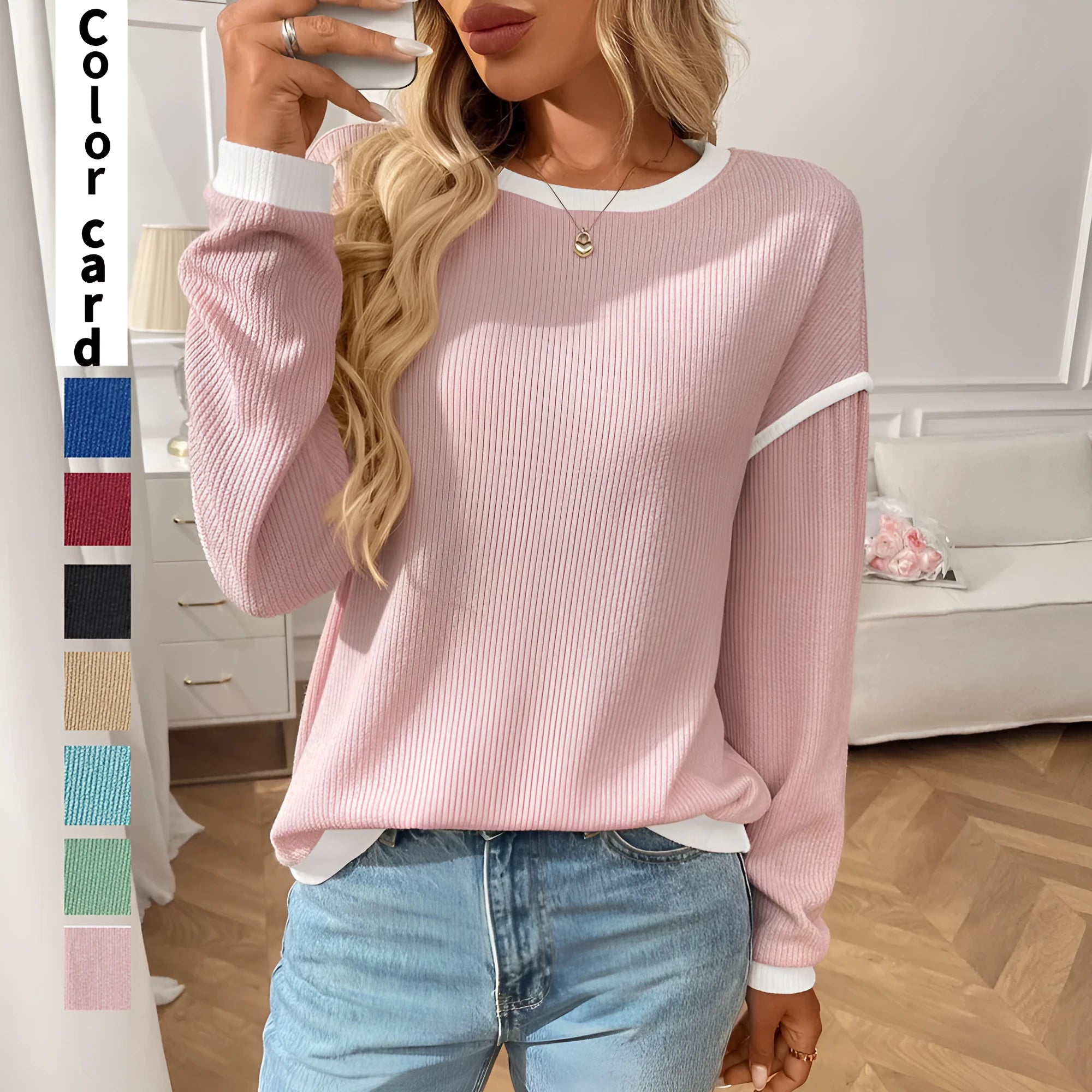 Women's loose fit polyester pullover top in light aqua blue with round neck and long sleeves.