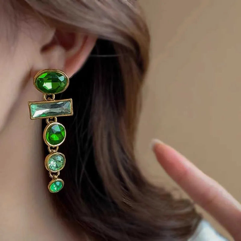 Retro green geometric earrings with dangling tassels and zircon detailing on alloy studs