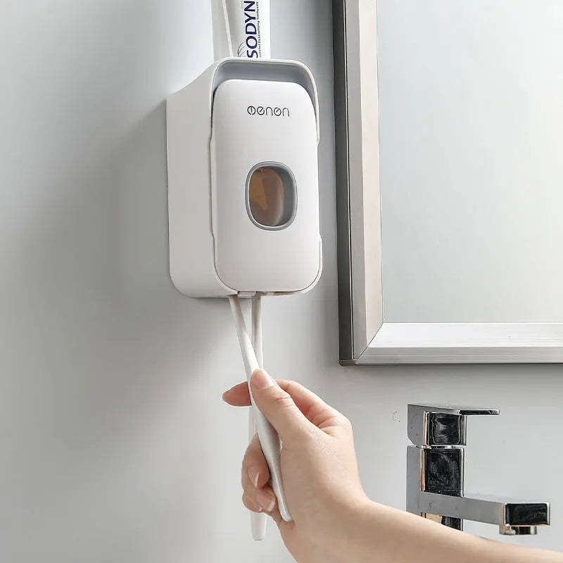 Automatic wall-mounted toothpaste dispenser in blue, grey, or pink colours with LED display