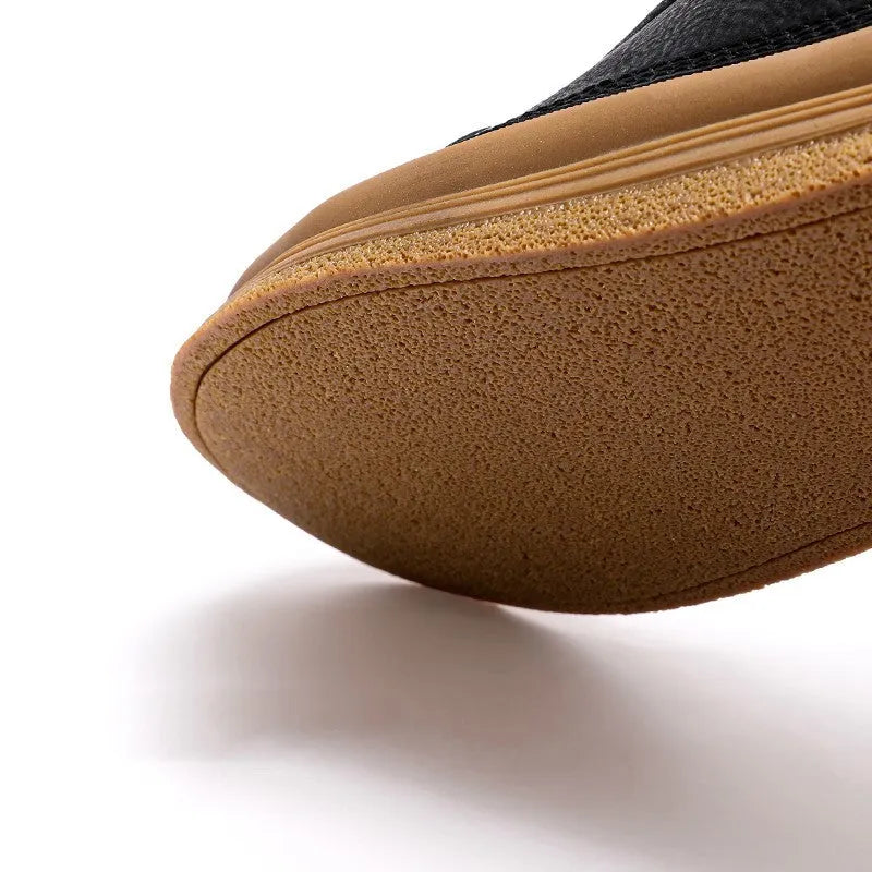 Men's black and white casual leather shoes with round toe and flat rubber sole