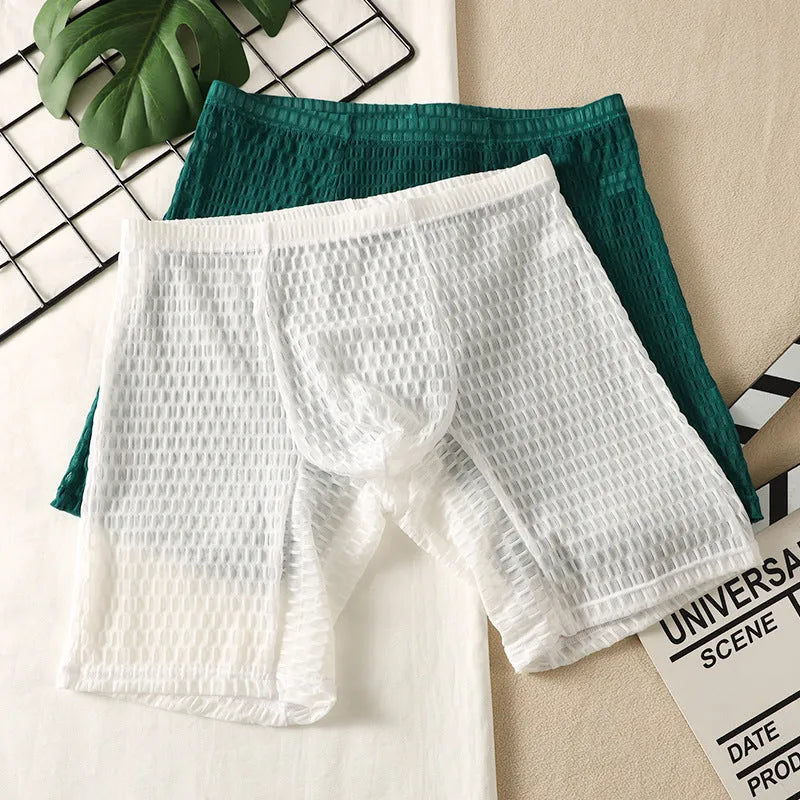 Men's solid colour lace boxer shorts with a lengthened hip lifting design on a size chart.