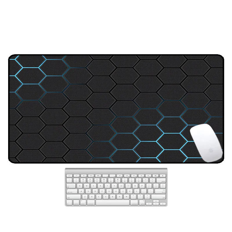 Large rectangular desk mouse pad with printed geometric pattern on a natural rubber non-slip base.