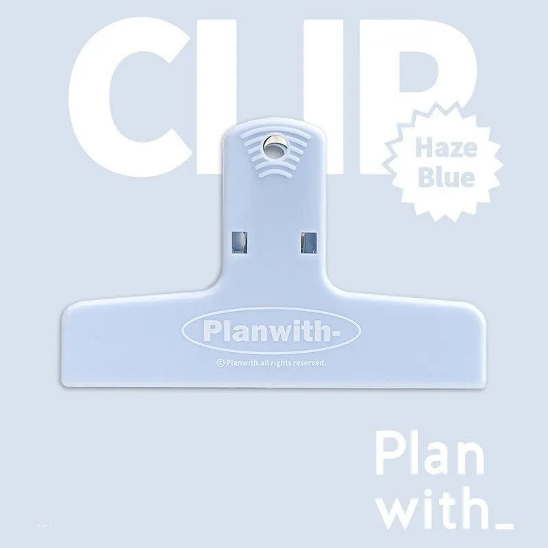 RosyPosy Haze Series blue magnetic bill clip holding receipts on a refrigerator.