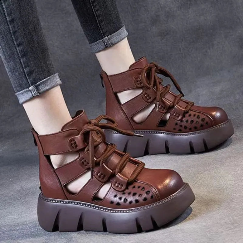 Women's black platform sandals with hollow hole design and fish-mouth toe, made from soft cowhide leather.