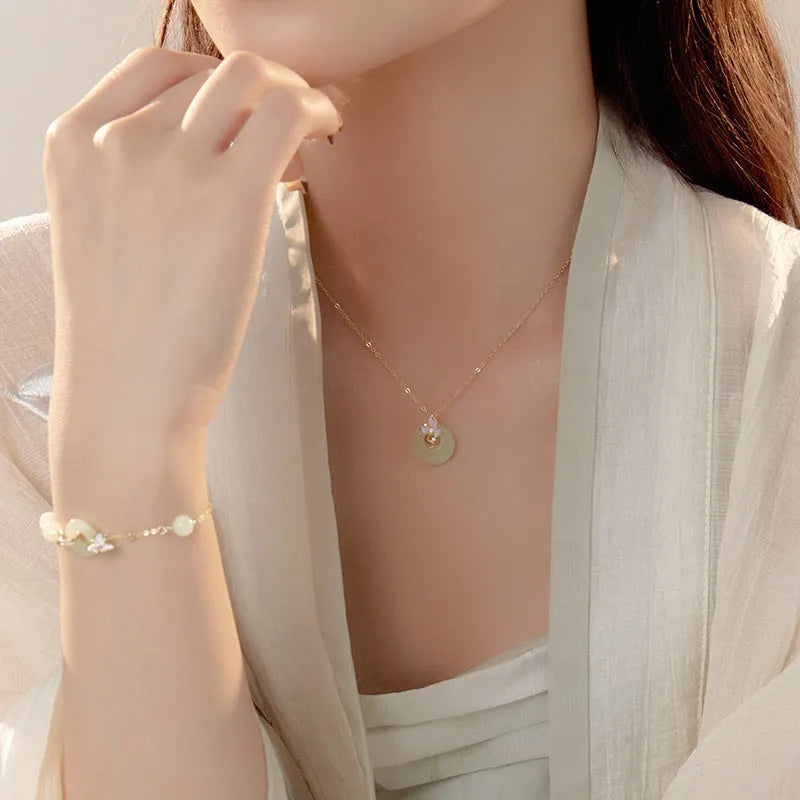 Sterling silver butterfly orchid necklace with floral pendant and peace buckle fastening