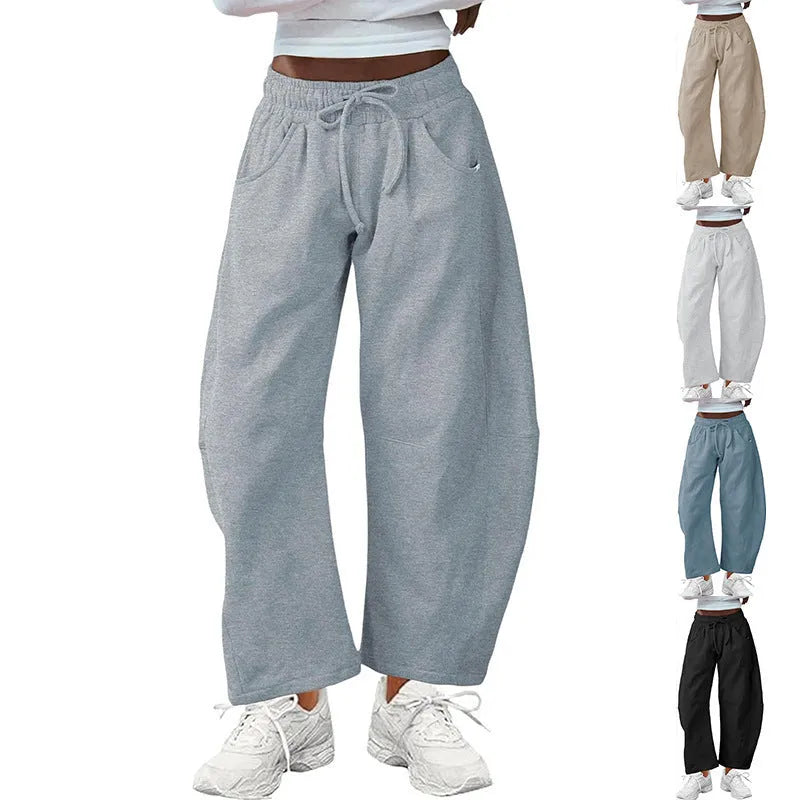 Loose cotton cropped sweatpants with drawstring waist in apricot colour showing street fashion styling