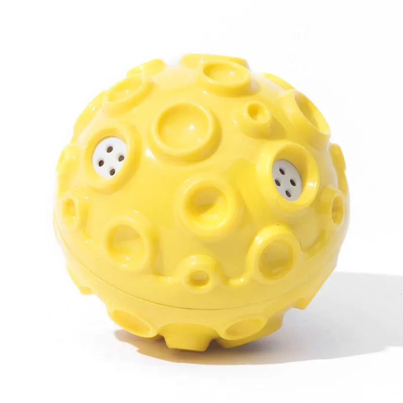 Colourful natural rubber dog chew ball with textured surface and meteorite-shaped bumps