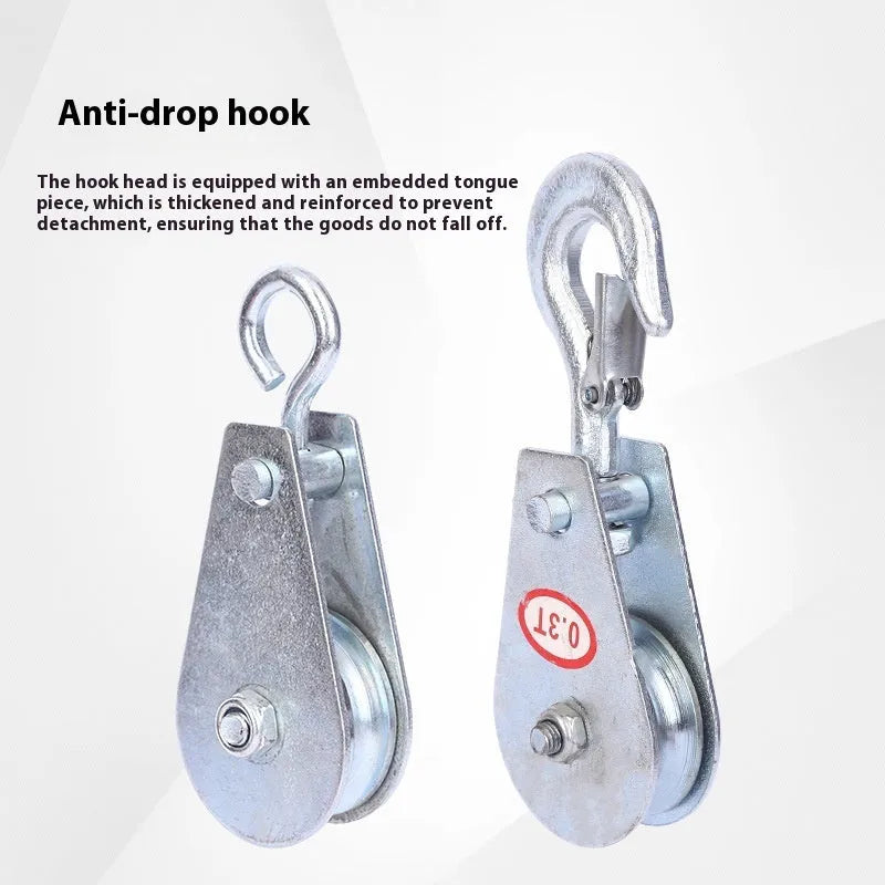 A small red industrial lifting pulley with a forged steel hook and safety latch.