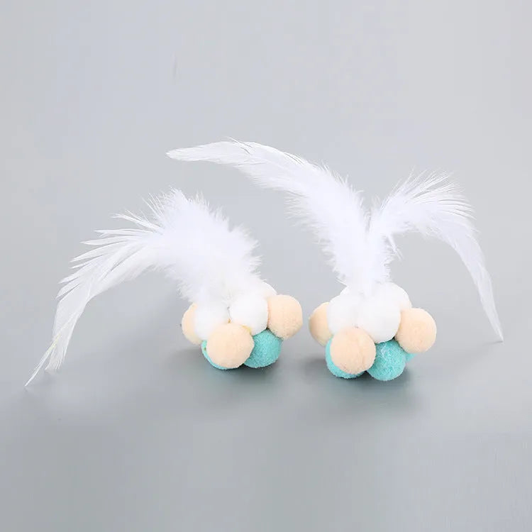 Cat toy feather wand with colourful pink and blue white feathers and a bouncy ball.