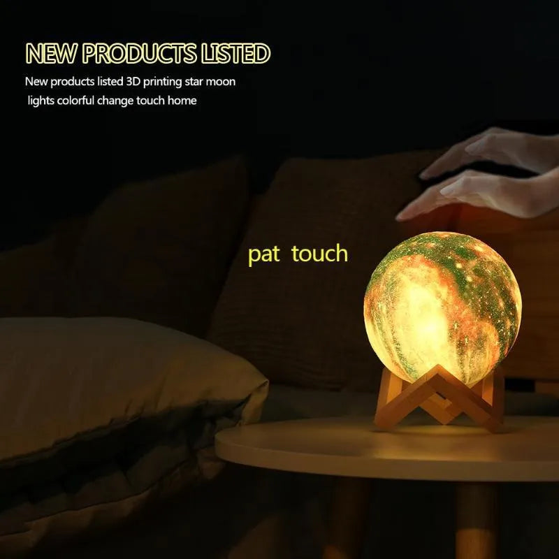 White spherical lunar night light with textured surface and soft LED glow on a dark surface.