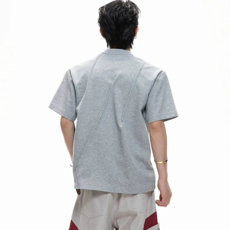 Men's loose fit cotton T-shirt with three-dimensional pleated design in solid colour options
