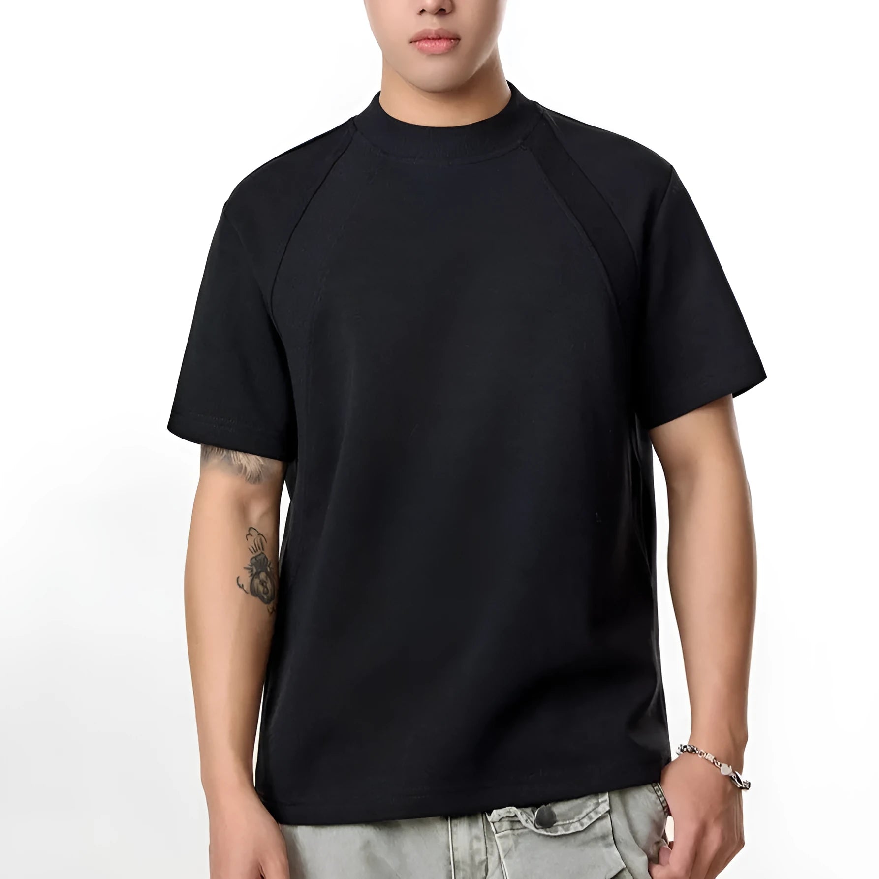 Loose grey short sleeve top with air layer stitching on a hanger.